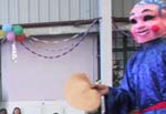 Traditional lion dance complete with the clown